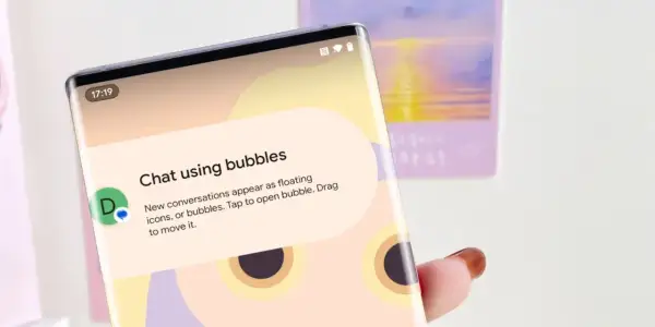 Jak włączyć dymki czatu na Messengerze na iPhonie? Ekran telefonu pokazuje instrukcję "Chat using bubbles", wyjaśniającą jak włączyć pływające okienka.